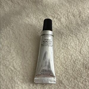 Grown Alchemist Silver Lip Balm Tube with Black Cap